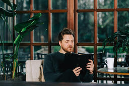 Man Reading the Bible with a Cup of Coffee  image 4