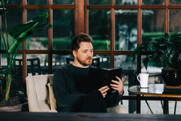 Man Reading the Bible with a Cup of Coffee  image 3