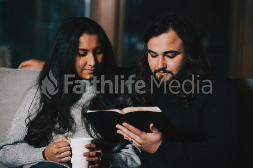 Husband and Wife Reading the Bible Together