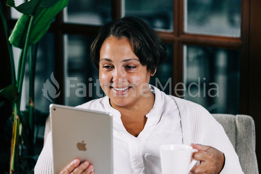 Woman Reading on a Tablet