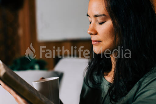 Woman Praying During Devotions