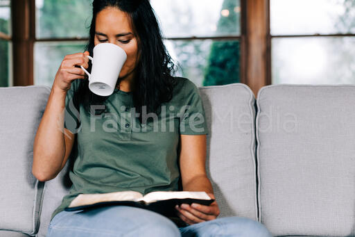Woman Reading the Bible and Drinking Coffee