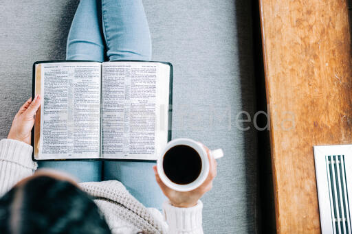 Woman Reading the Bible with a Cup of Coffee