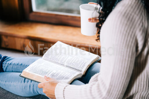 Woman Reading the Bible with a Cup of Coffee