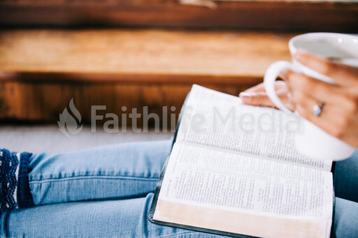 Woman Reading the Bible with a Cup of Coffee