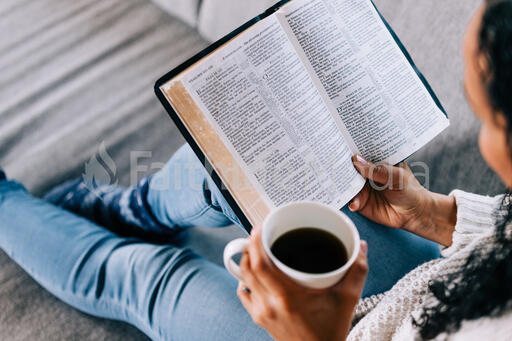 Woman Reading the Bible with a Cup of Coffee