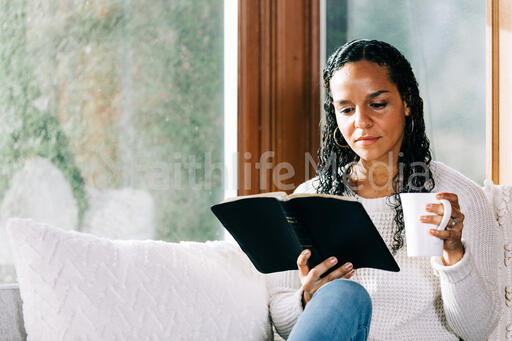 Woman Reading the Bible with a Cup of Coffee