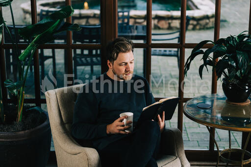 Man Reading the Bible with a Cup of Coffee