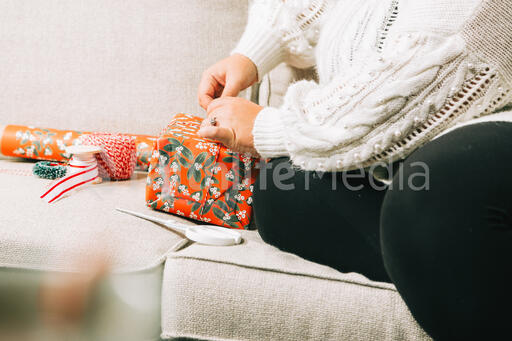 Woman Wrapping a Christmas Present