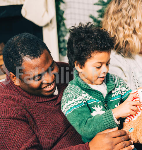 Father and Son Opening a Christmas Present Together