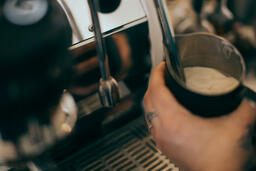 Barista Steaming Milk for a Latte  image 1