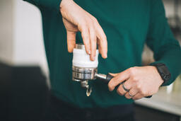 Barista Preparing to Pull Shots of Espresso with a Portafilter  image 1