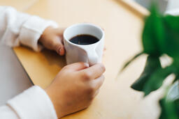 Hands Holding a Cup of Coffee  image 1