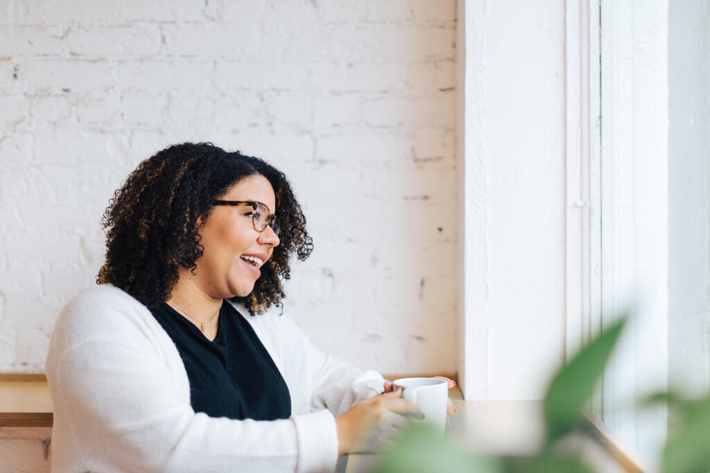 Woman Laughing with a Cup of Coffee large preview