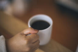 Woman Holding a Cup of Coffee  image 2