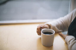 Woman Grasping Her Cup of Coffee  image 3