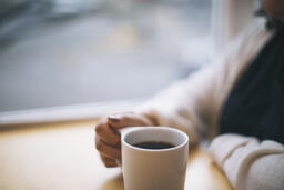 Woman Grasping Her Cup of Coffee  image 2