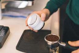 Barista Preparing to Pull Shots of Espresso with a Portafilter  image 1
