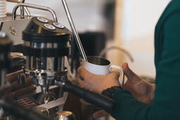 Barista Steaming Milk for a Latte  image 1