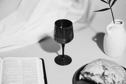 Communion Bread, Wine, Bible and Vase on Table  image 6
