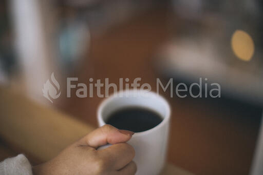 Woman Holding a Cup of Coffee