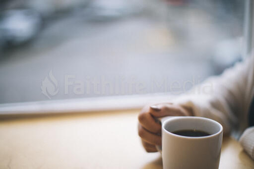 Woman Grasping Her Cup of Coffee