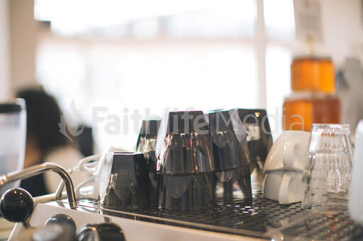 Cups Stacked on Top of an Espresso Machine