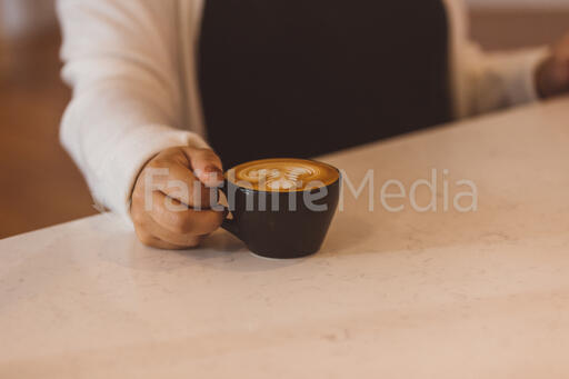 Customer Grabbing Her Latte