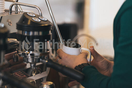 Barista Steaming Milk for a Latte