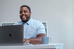Man Working on Laptop in Office  image 1