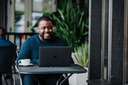 Man Working on Laptop at Coffee Shop  image 10