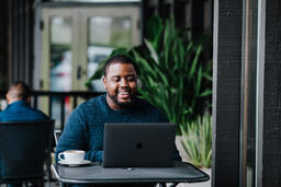Man Working on Laptop at Coffee Shop  image 8