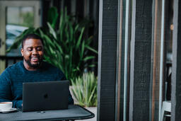 Man Working on Laptop at Coffee Shop  image 7