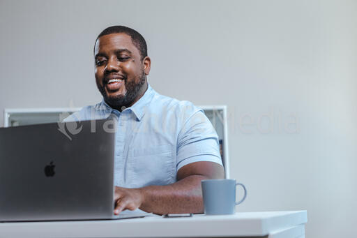 Man Working on Laptop in Office
