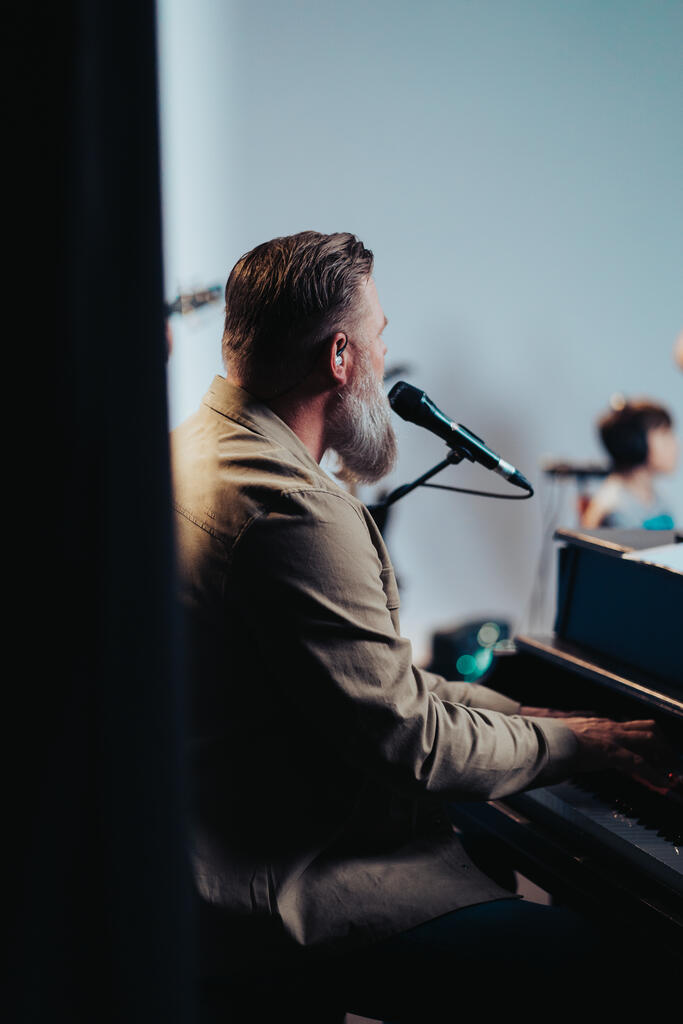 Worship Leader Singing and Playing Piano large preview