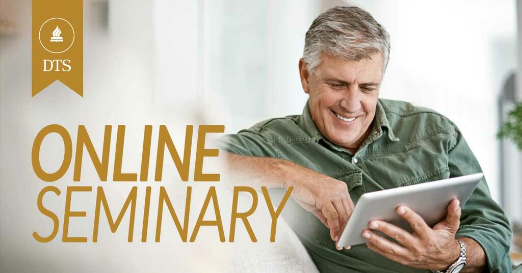 Gentleman taking online classes smiling in front of iPad at home