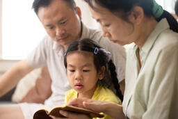 Family Reading the Bible Together at Home  image 3