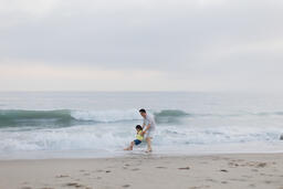 Father and Daughter Playing at the Beach  image 3