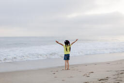 Young Girl Playing at the Beach  image 1