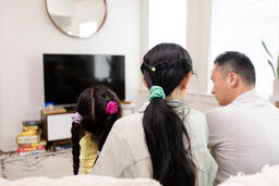 Family Watching TV Together  image 2