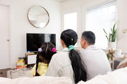 Family Watching TV Together  image 6