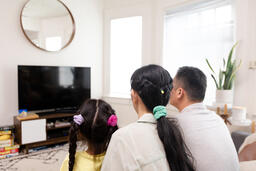 Family Watching TV Together  image 5