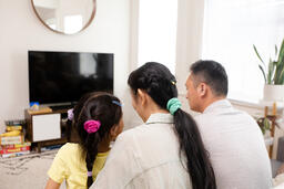 Family Watching TV Together  image 3