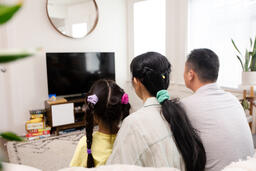 Family Watching TV Together  image 1