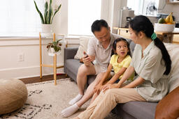 Family Looking at a Smart Phone Together  image 3