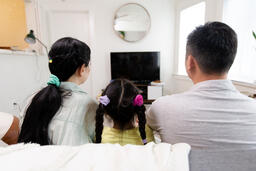 Family Watching TV Together  image 7