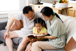 Family Reading the Bible Together at Home  image 4