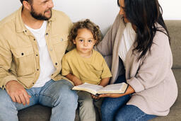 Young Family Reading the Bible Together  image 5