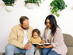 Young Family Reading the Bible Together  image 4