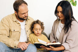Young Family Reading the Bible Together  image 3